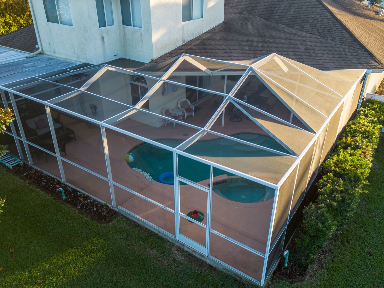Aluminium pool screen enclosure over a South Florida pool and patio